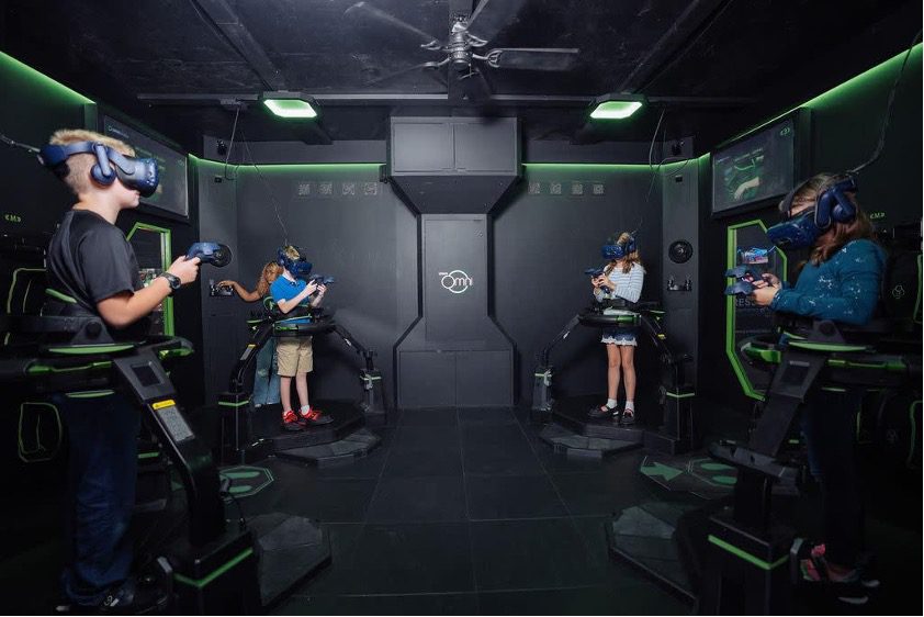 Several children in an immersive VR experience at Press Play Gaming Lounge in Brownsburg, Indiana