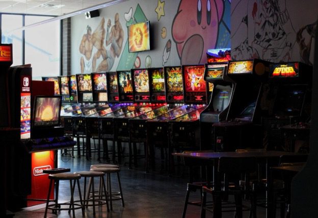 A Nintendo Switch Kiosk, various arcade cabinets and pinball machines at Tappers Arcade Bar in Indianapolis, Indiana